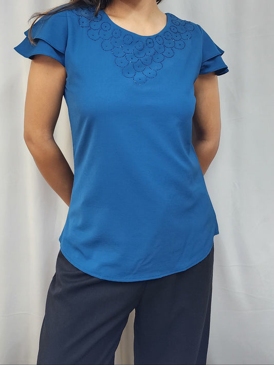 WOMENS SOLID TOP WITH DIAMOND EMBELLISHMENT. ROUND NECK, LAYERED RUFFLE SLEEVES.