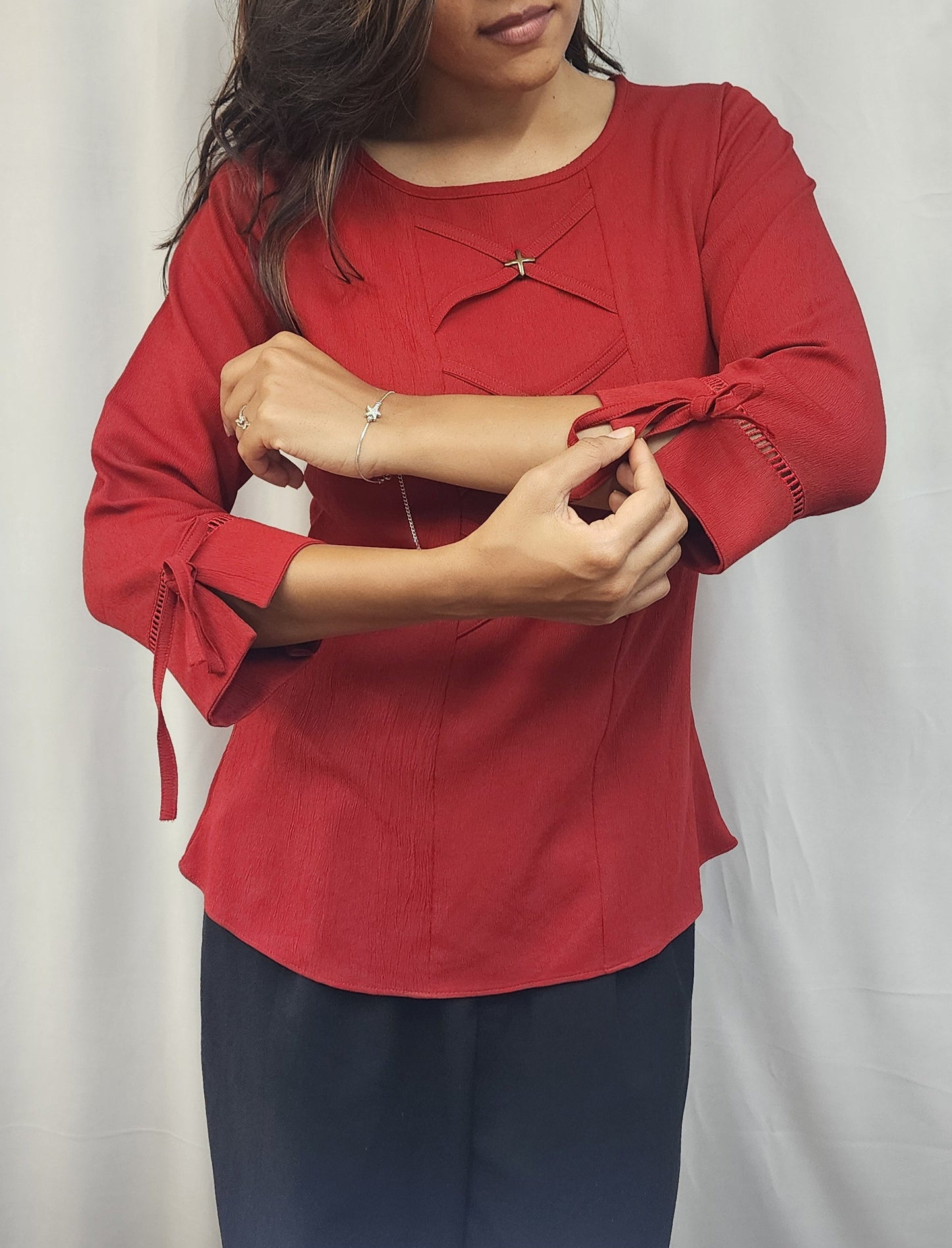 WOMENS SOLID RED TOP WITH FABRIC & METAL DETAIL IN THE FRONT & 3/4TH SLEEVES WITH LACE & TIE-UP.