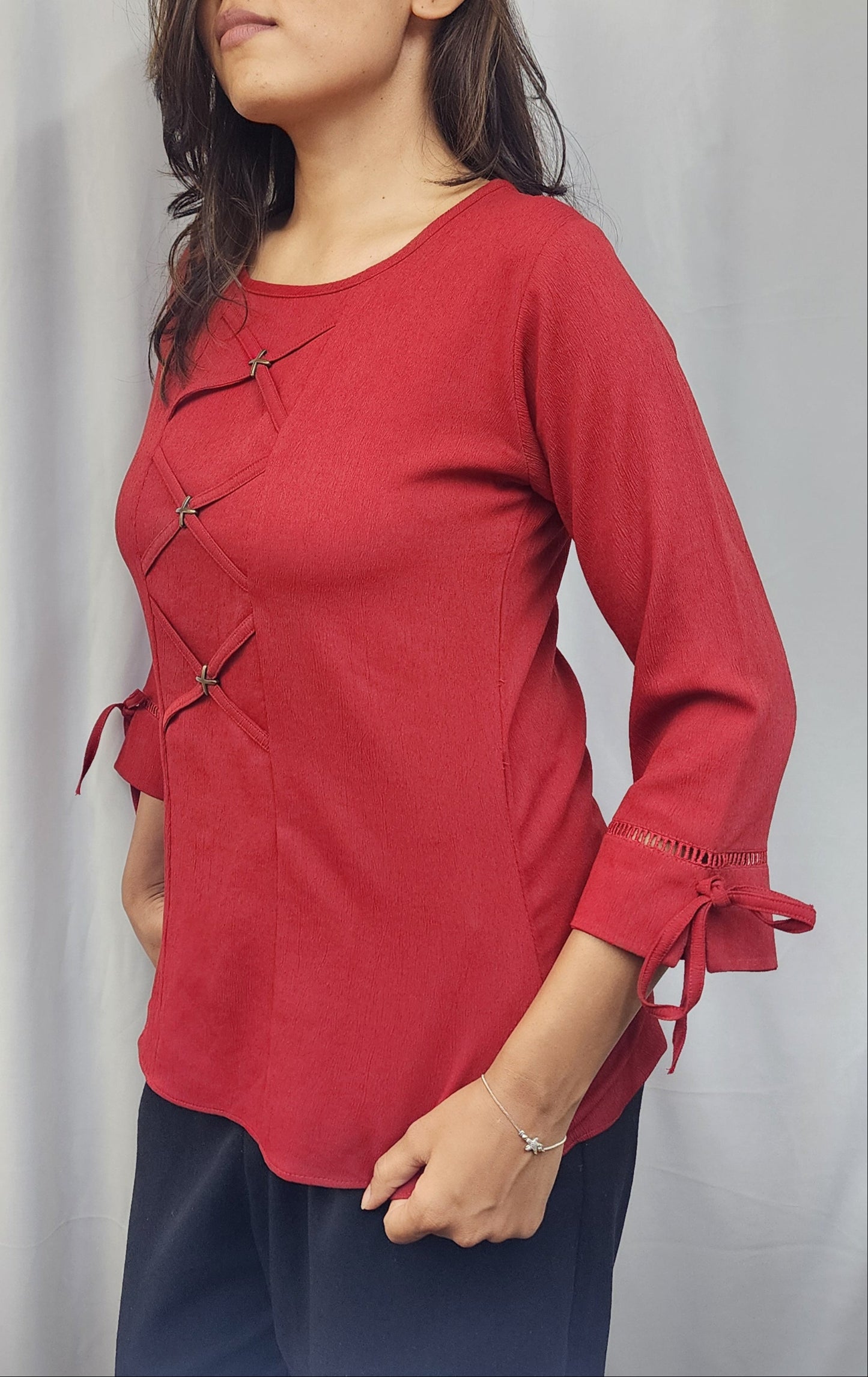 WOMENS SOLID RED TOP WITH FABRIC & METAL DETAIL IN THE FRONT & 3/4TH SLEEVES WITH LACE & TIE-UP.