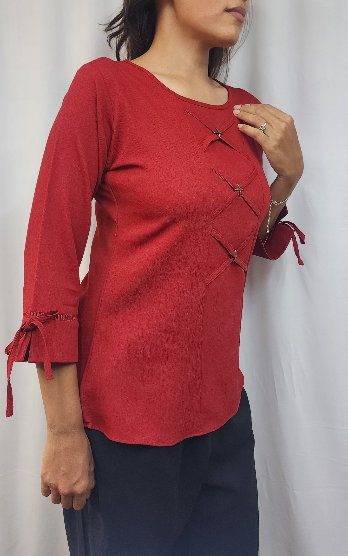 WOMENS SOLID RED TOP WITH FABRIC & METAL DETAIL IN THE FRONT & 3/4TH SLEEVES WITH LACE & TIE-UP.