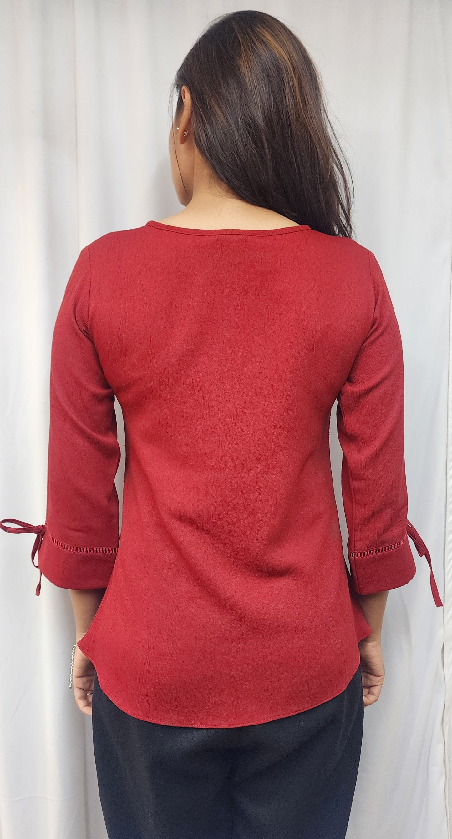 WOMENS SOLID RED TOP WITH FABRIC & METAL DETAIL IN THE FRONT & 3/4TH SLEEVES WITH LACE & TIE-UP.