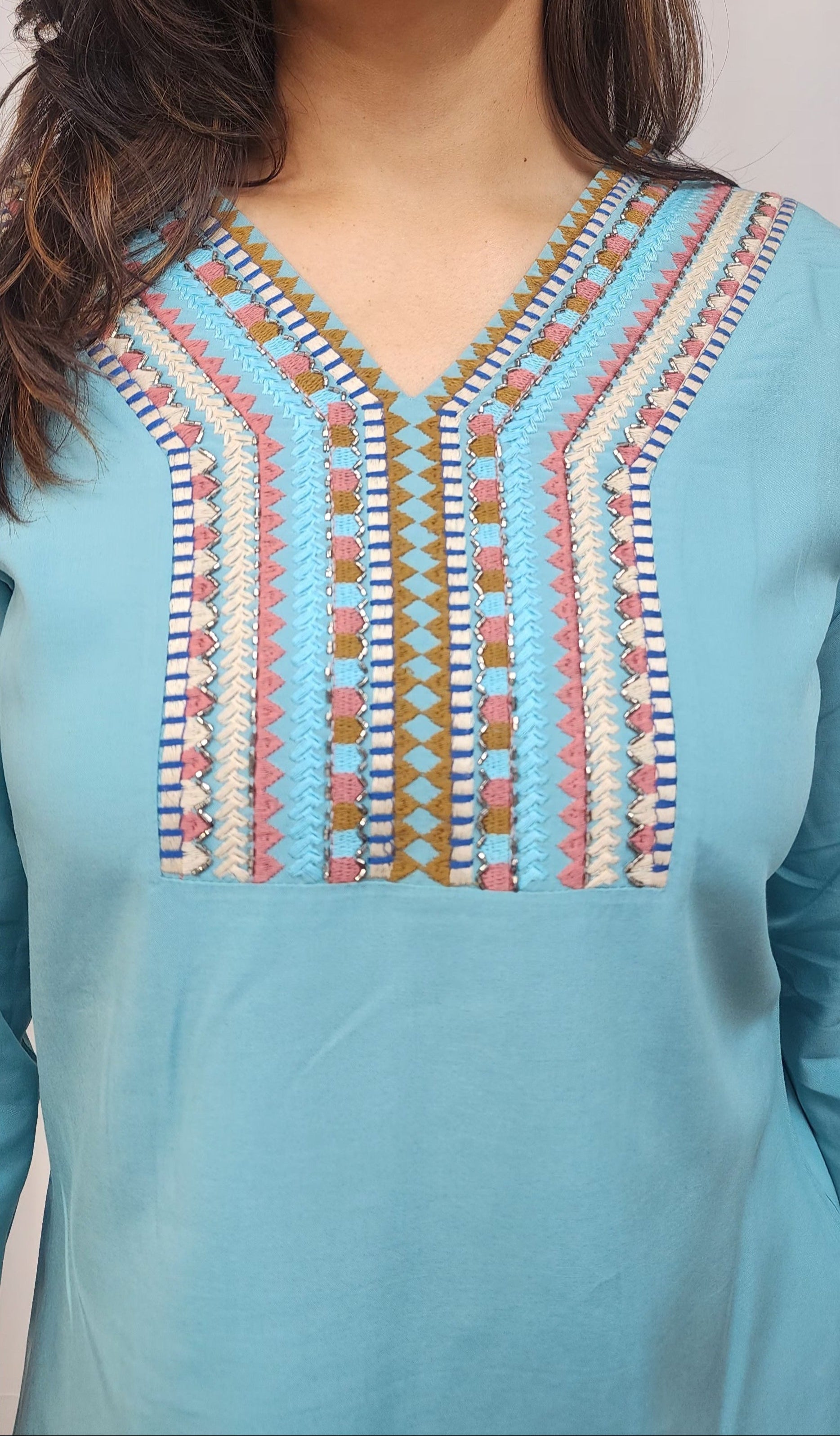 WOMENS SOLID EMBROIDERED TOP IN BLUE WITH V NECK, 3/4 TH SLEEVES, COLOURFUL GEOMETRIC EMBROIDERY ON THE YOKE