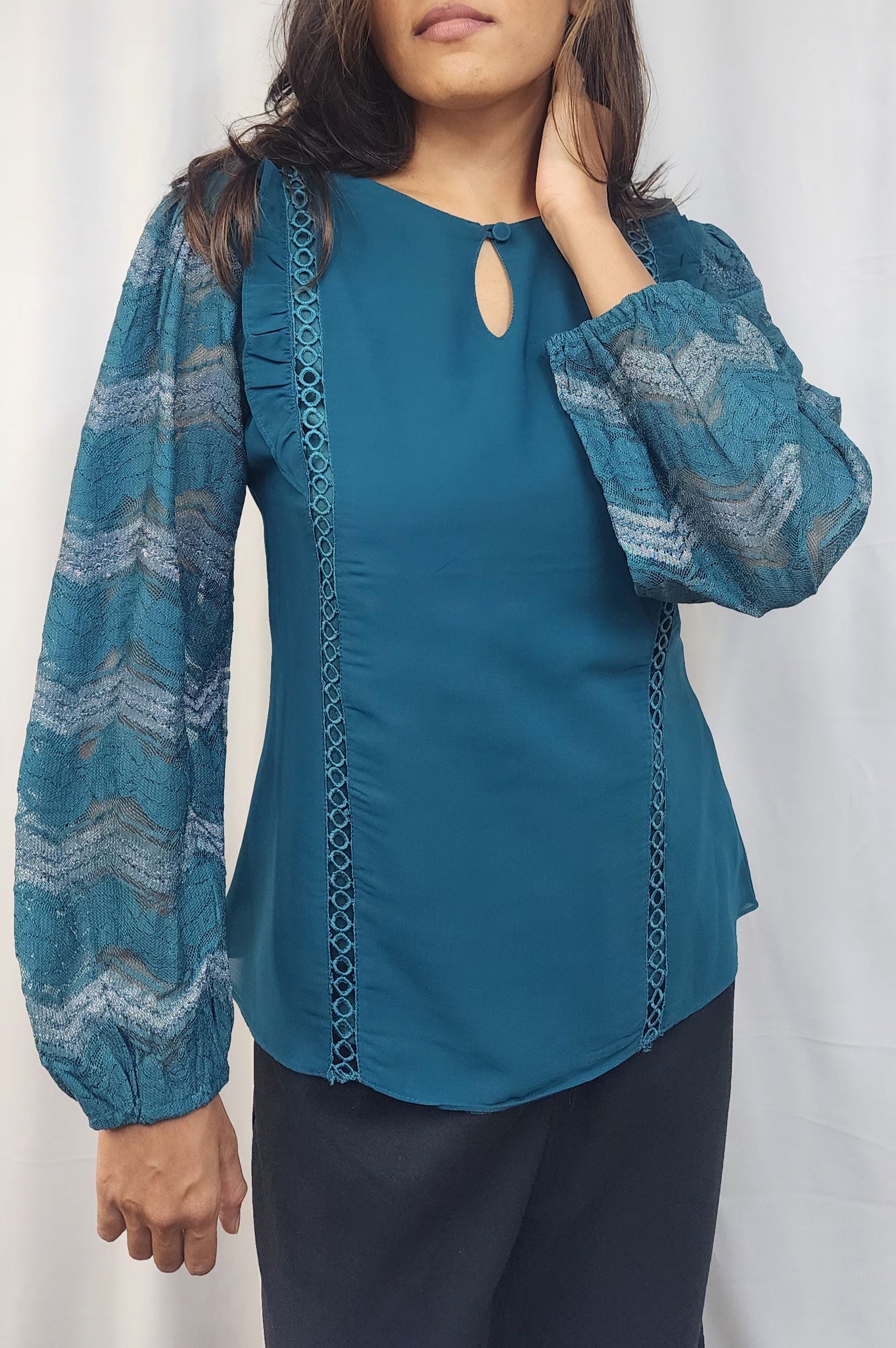 WOMENS SOLID TOP IN BLUE WITH KEYHOLE NECK. LACE & RUFFLE DETAILING ON BODY & LACE SLEEVES