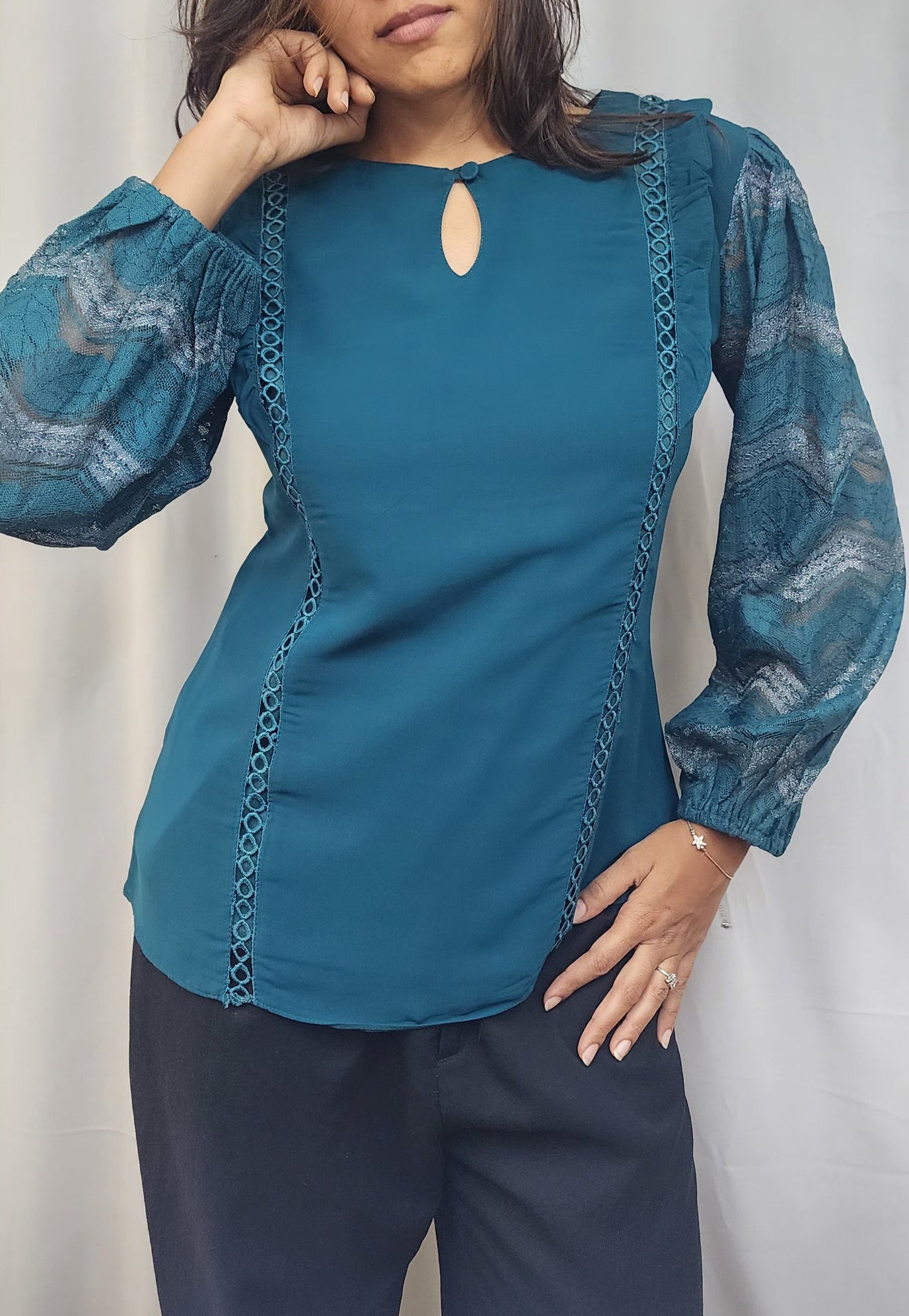 WOMENS SOLID TOP IN BLUE WITH KEYHOLE NECK. LACE & RUFFLE DETAILING ON BODY & LACE SLEEVES