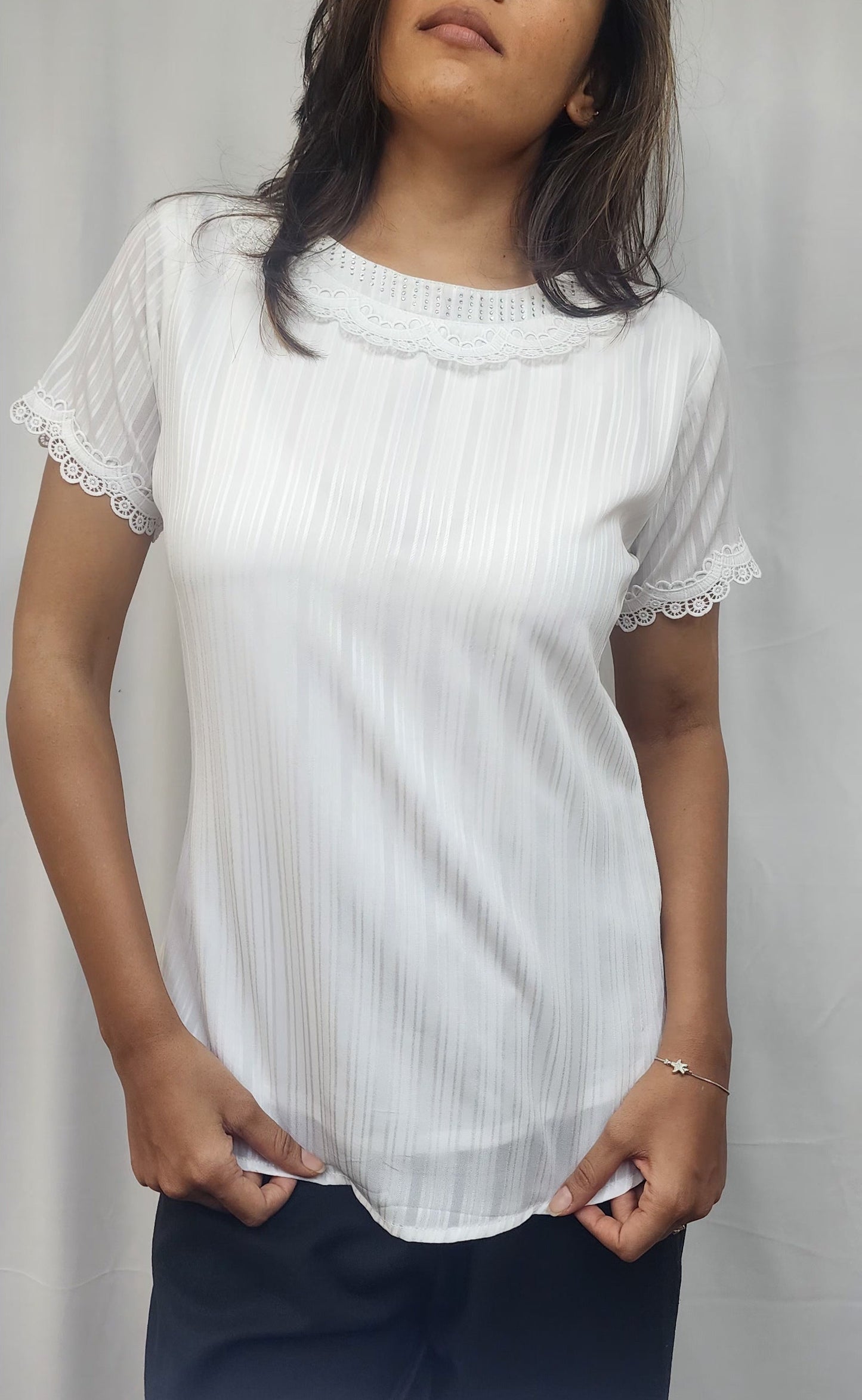 WOMENS SOLID TEXTURED TOP WITH LACE DETAILING ON NECKLINE . DIAMOND EMBELLISHMENT ON NECK & SHORT SLEEVES WITH LACE DETAIL