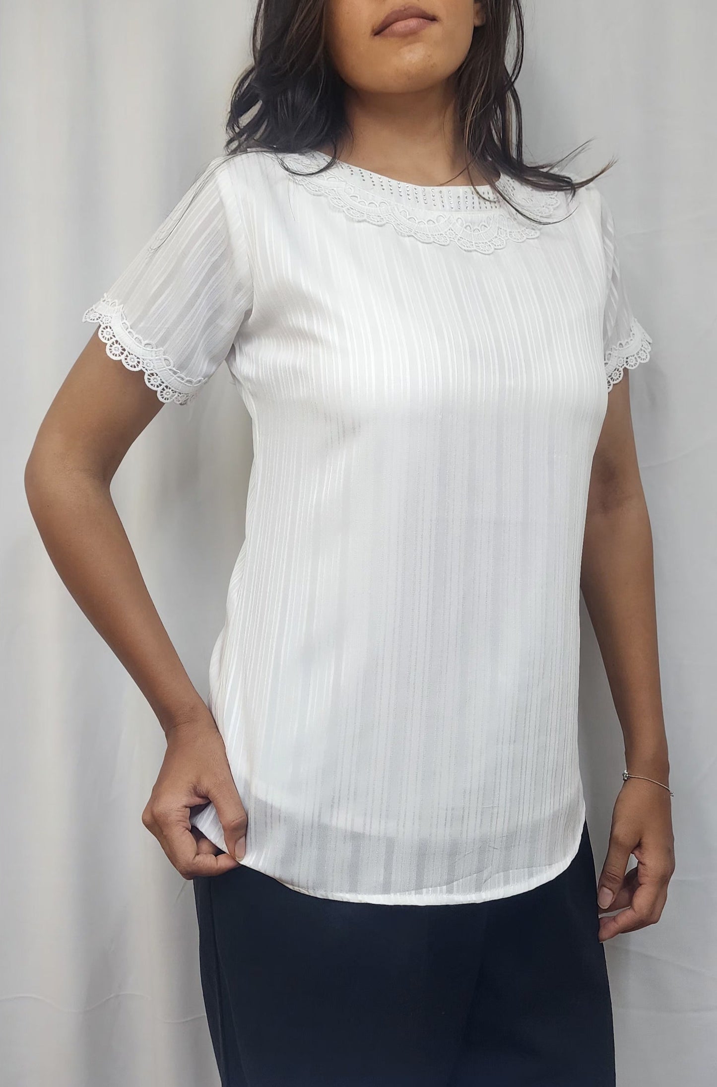WOMENS SOLID TEXTURED TOP WITH LACE DETAILING ON NECKLINE . DIAMOND EMBELLISHMENT ON NECK & SHORT SLEEVES WITH LACE DETAIL