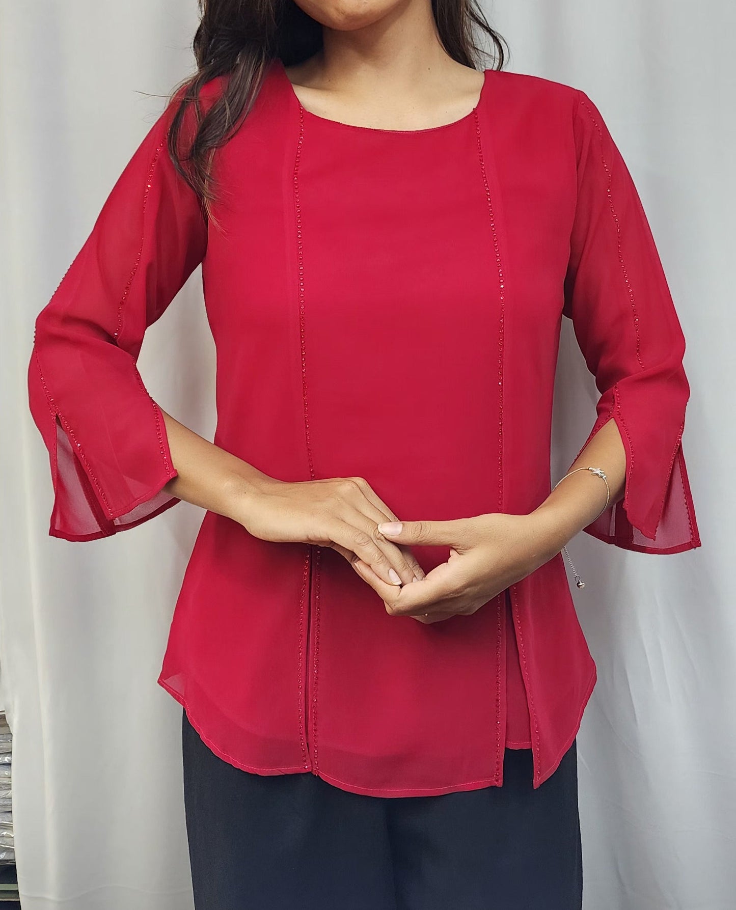 WOMENS SOLID TOP WITH DIAMOND EMBELLISHMENT IN PINK. ROUND NECK, 3/4TH SLEEVES WITH SLIT ON FRONT & SLEEVES.