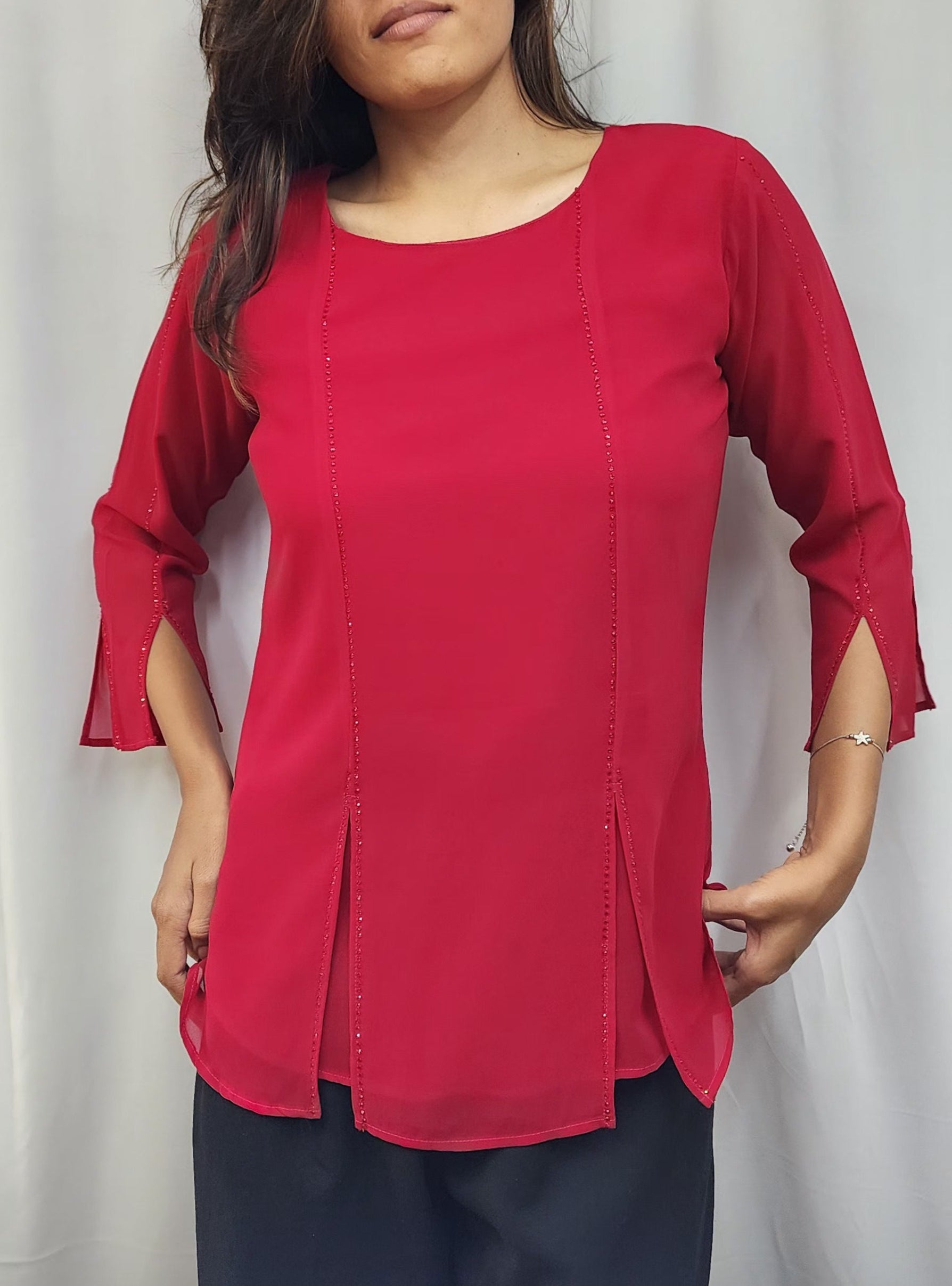 WOMENS SOLID TOP WITH DIAMOND EMBELLISHMENT IN PINK. ROUND NECK, 3/4TH SLEEVES WITH SLIT ON FRONT & SLEEVES.