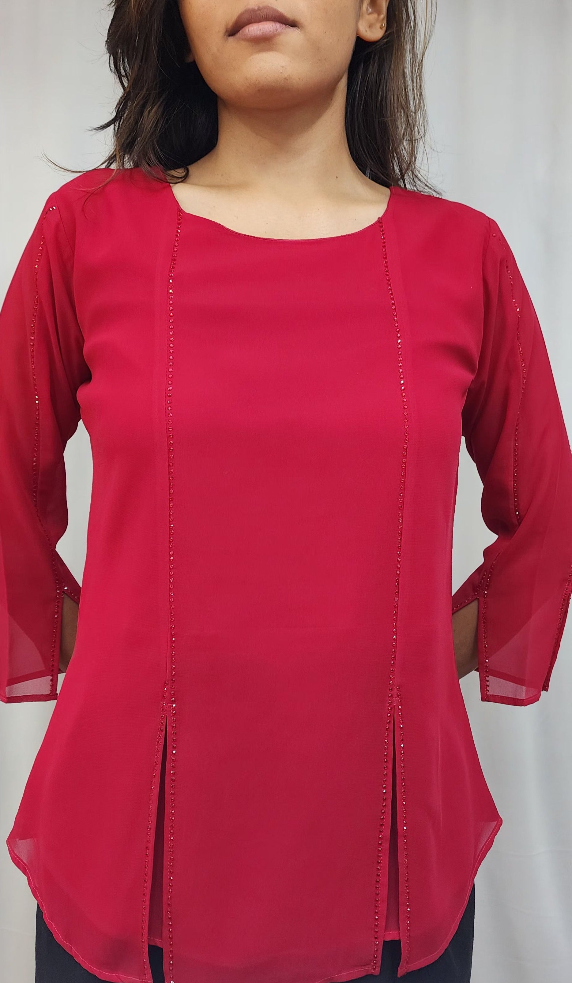 WOMENS SOLID TOP WITH DIAMOND EMBELLISHMENT IN PINK. ROUND NECK, 3/4TH SLEEVES WITH SLIT ON FRONT & SLEEVES.