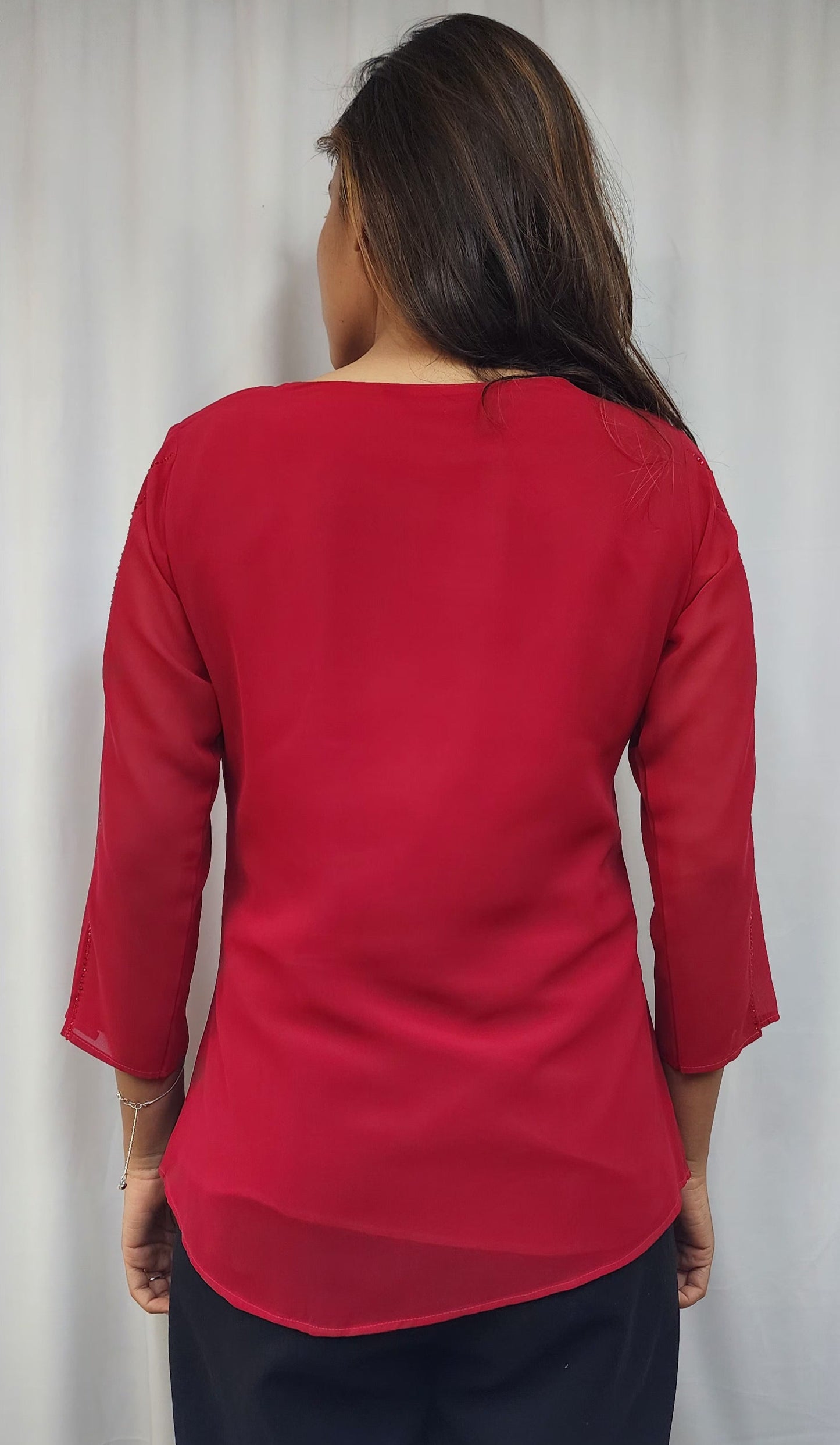WOMENS SOLID TOP WITH DIAMOND EMBELLISHMENT IN PINK. ROUND NECK, 3/4TH SLEEVES WITH SLIT ON FRONT & SLEEVES.