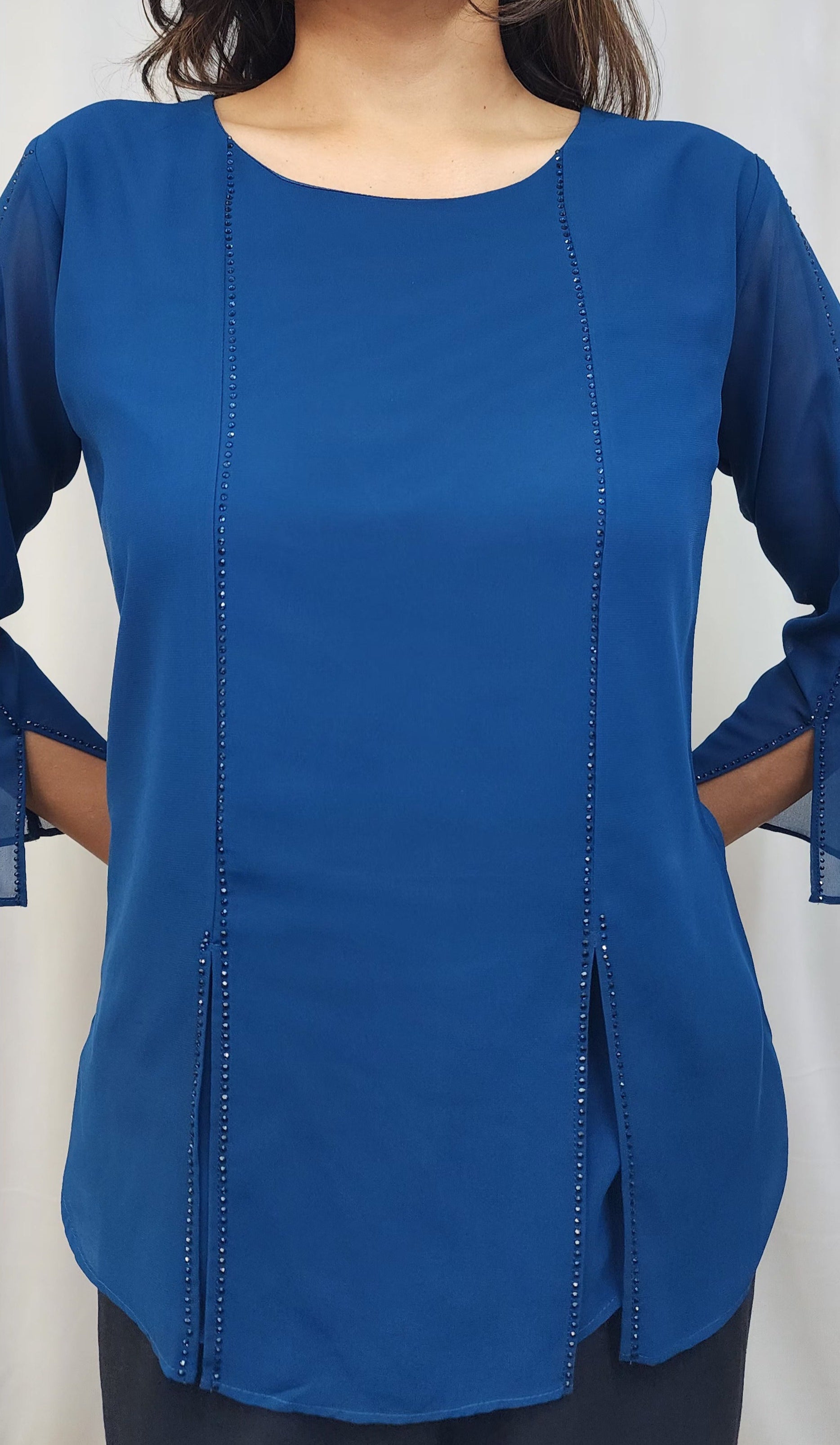 WOMENS SOLID TOP WITH DIAMOND EMBELLISHMENT IN BLUE. ROUND NECK, 3/4TH SLEEVES WITH SLIT ON FRONT & SLEEVES.