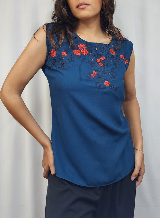 WOMENS SOLID TOP WITH FLORAL EMBROIDERY. SLEEVELESS ROUND NECK TOP
