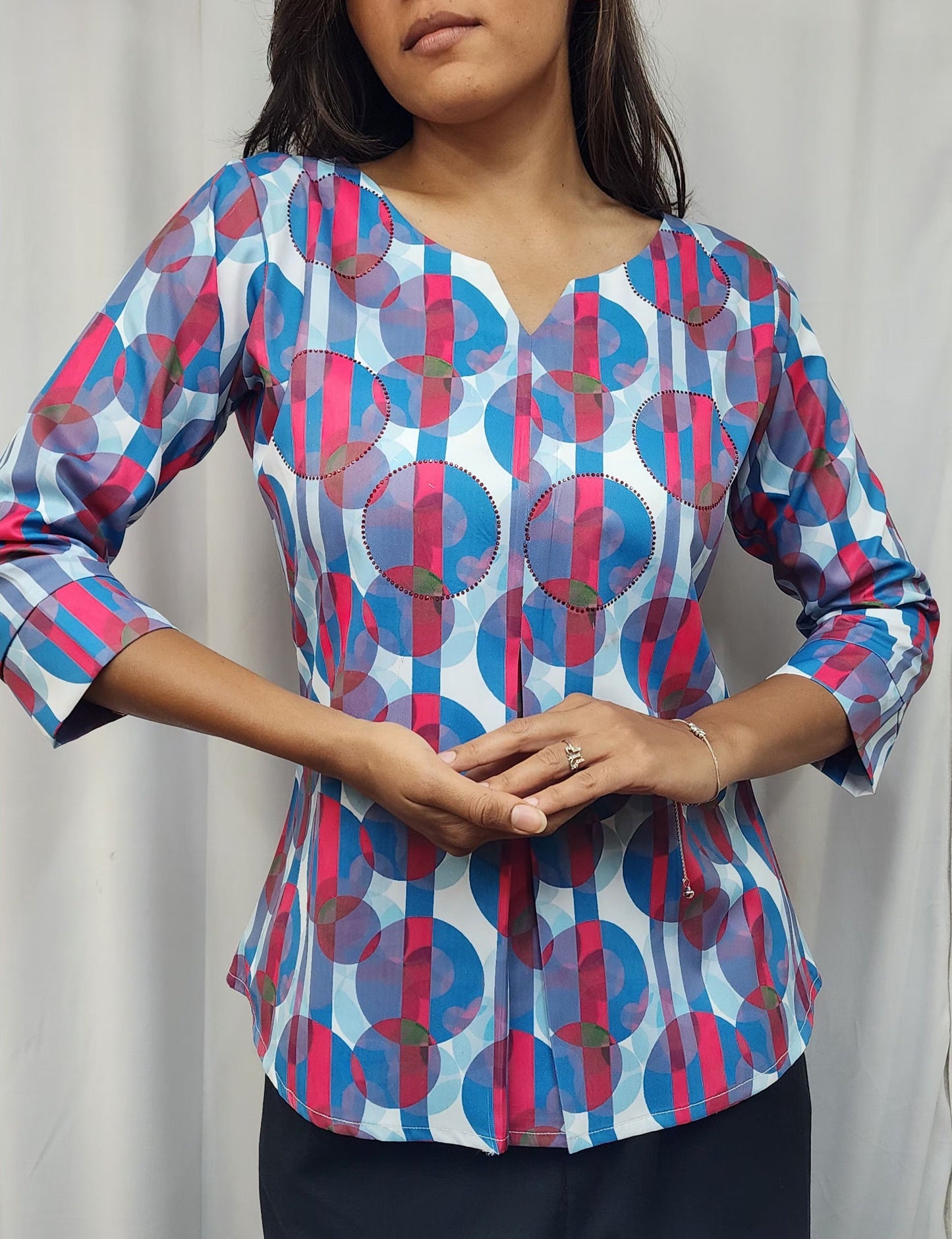 WOMENS ABSTRACT PRINTED DIAMOND EMBELLISHED TOP WITH ROUND NECK, 3/4TH SLEEVES. DIAMONDS HIGHLIGHTED ON PRINT.