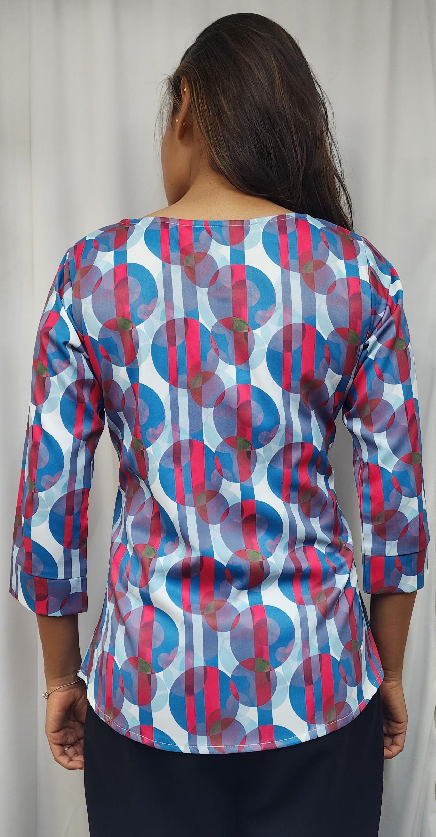 WOMENS ABSTRACT PRINTED DIAMOND EMBELLISHED TOP WITH ROUND NECK, 3/4TH SLEEVES. DIAMONDS HIGHLIGHTED ON PRINT.