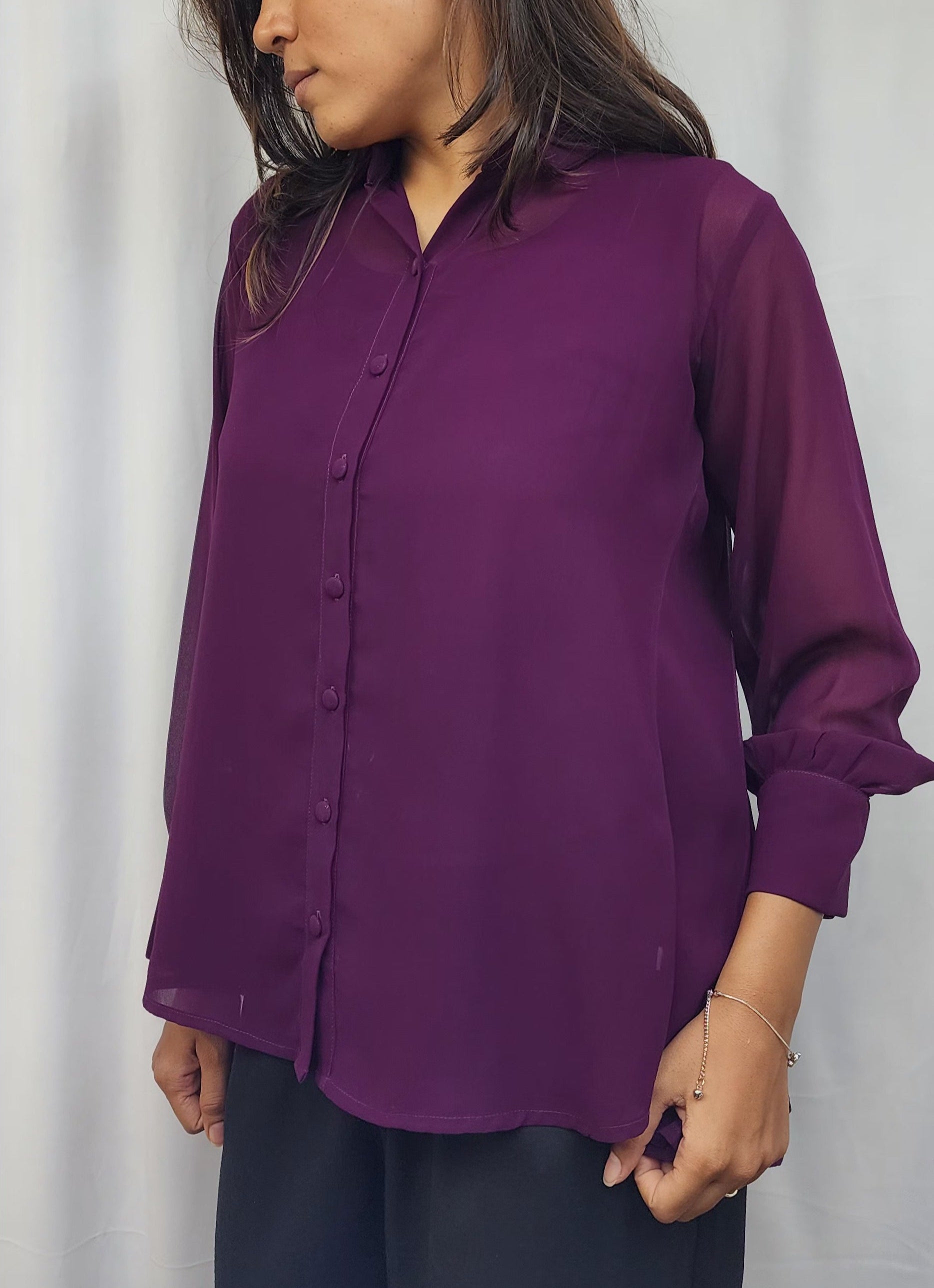 WOMENS SOLID PURPLE SHIRT WITH FLARE. BACK YOKE WITH PLEATED. FLY COLLAR, FULL SLEEVES WITH CUFF