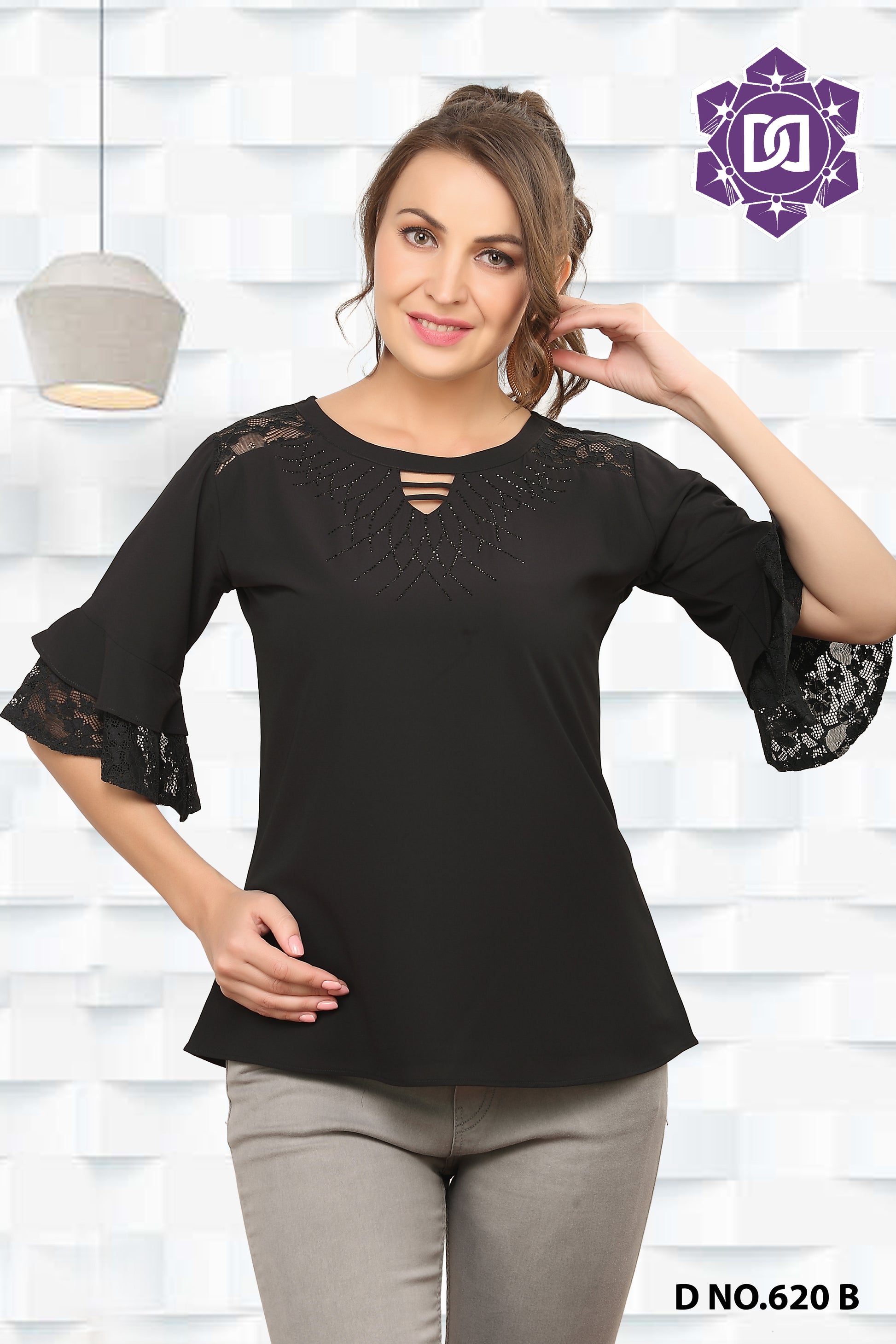 A woman wearing a black western top with lace detailing and a round neckline.